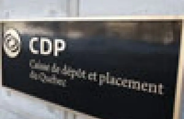 A woman walks out of the Caisse de depot et placement du Quebec head office in Quebec City
