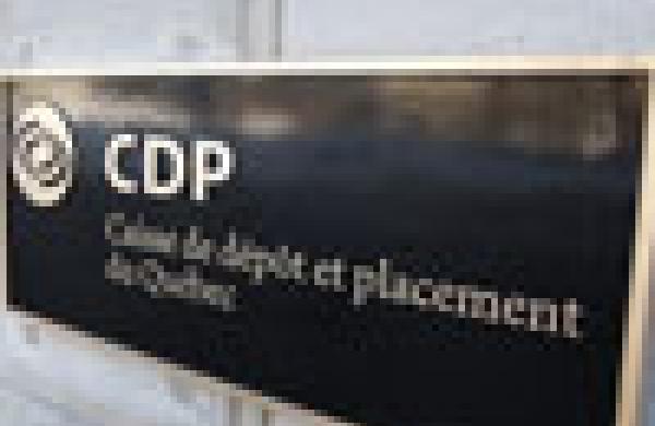 A woman walks out of the Caisse de depot et placement du Quebec head office in Quebec City