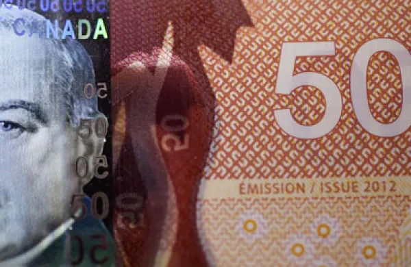 Canada's Dollar at Almost Eight-Month Low Before Economic Report