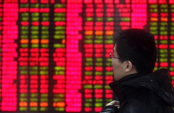 Investors Watch Stock Bords At A Security Firm