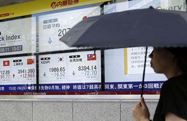 Stocks Boards And Chinese Yuan Banknotes AS China Devalues Yuan by Most in Two Decades