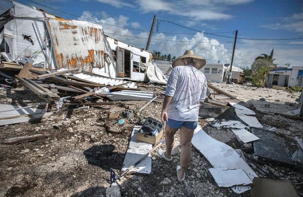 Photographs by Kadir van Lohuizen / NOOR / Redux. Sharon Noeller walks through Sea Breeze RV Park on Plantation Key after Hurricane Irma. She had lived there for 12 years.