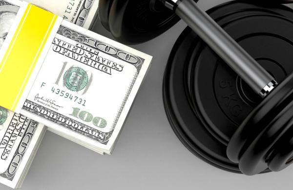 Dollar currency with dumbbell