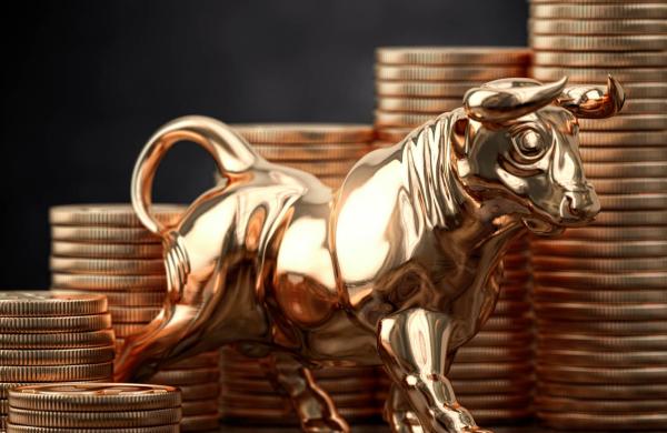 Golden bull and coins . Financial investment in bull market and growth of stock market concept.