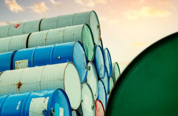 Old Chemical Barrels Stack. Red, Green, And Blue Chemical Drum. Steel Tank Of Flammable Liquid.