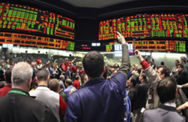 Traders Work At The Chicago Board Of Trade