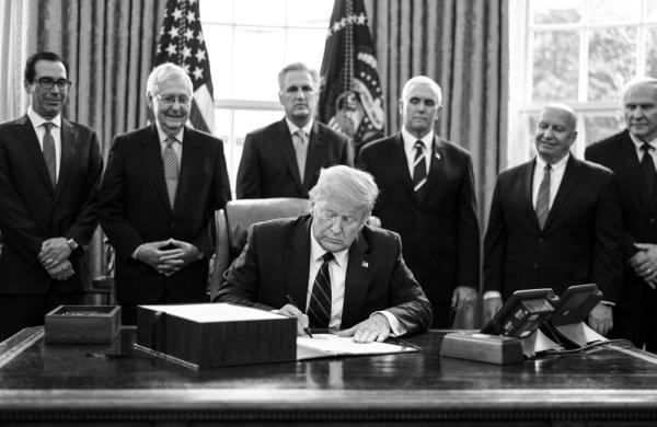 President Trump signs the H.R. 748, Coronavirus Aid, Relief, and Economic Security (CARES) Act (Erin Schaff/Bloomberg)