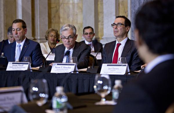 Joseph Otting, Jerome Powell, and Steven Mnuchin at the Financial Stability Oversight Council meeting. (Andrew Harrer/Bloomberg)