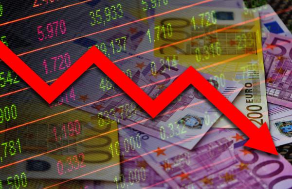 Economy graph: red down arrow, cash euro banknotes and stock exchange board