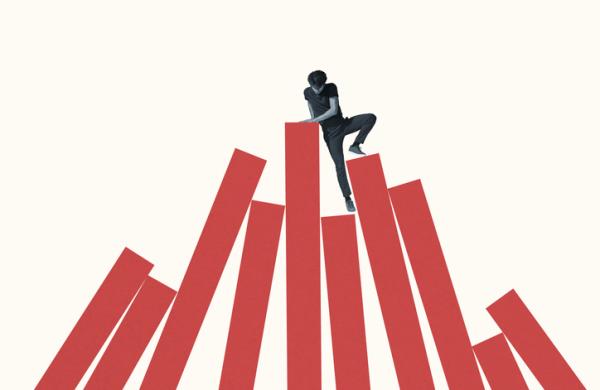 Young man climbing red bars