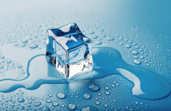 Blocks of Ice With water Drops close-up. Macro ice refreshing cube for a drink on a hot day