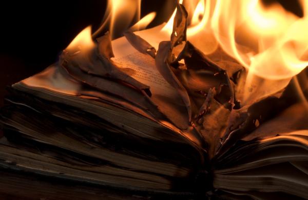 An open book is on fire