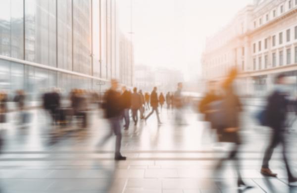 Beautiful motion blur of people walking in the morning rush hour, busy modern life concept. Suitable for web and magazine layouts.
