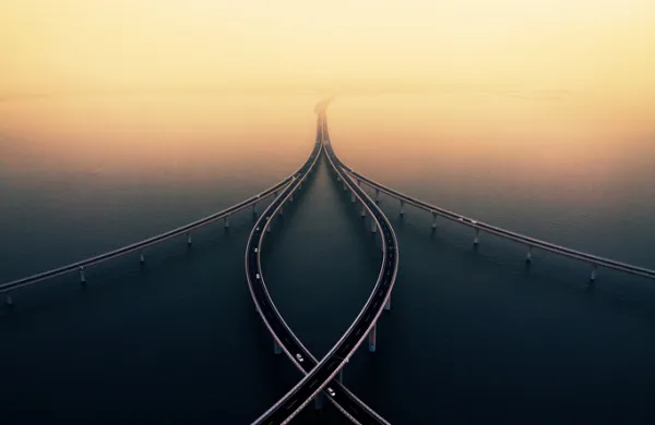 Sea crossing bridge at sunset