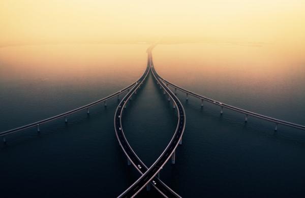 Sea crossing bridge at sunset