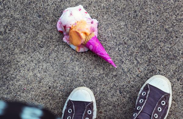 High angle view of ice cream fallen on footpath