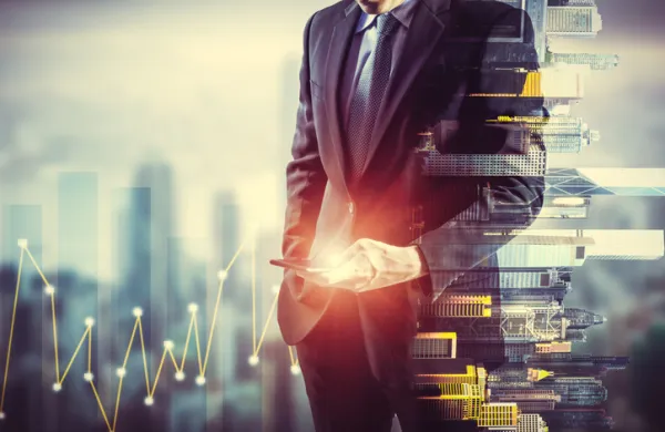 Businessman holding smart phone. Double exposure photo of city view background, Finance strategy concept.