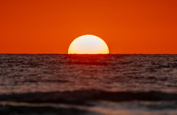 Scenic view of sea against orange sky,Indian Rocks Beach,Florida,United States,USA