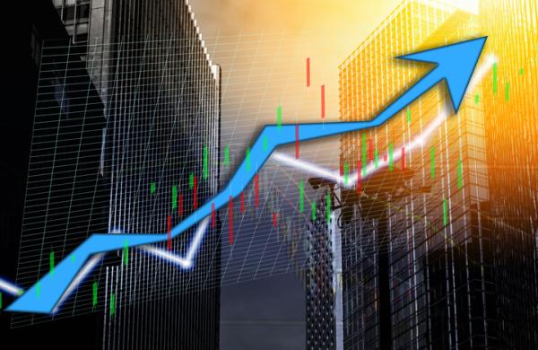 Composing with business building and stock chart on background (blue bull chart)