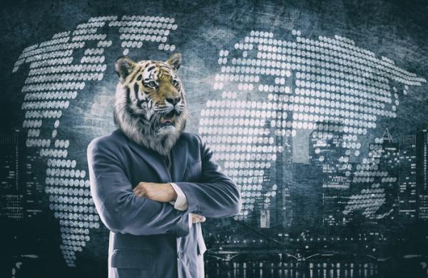 Humanoid Tiger head on businessman in a suit with world map
