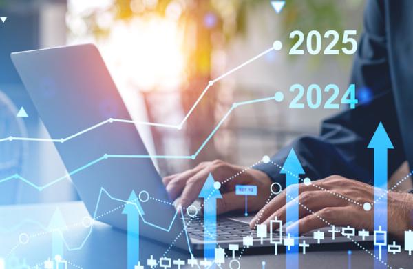Hands typing on a laptop with overlay of financial graphs and charts, in a modern office setting, concept of business growth and future forecast