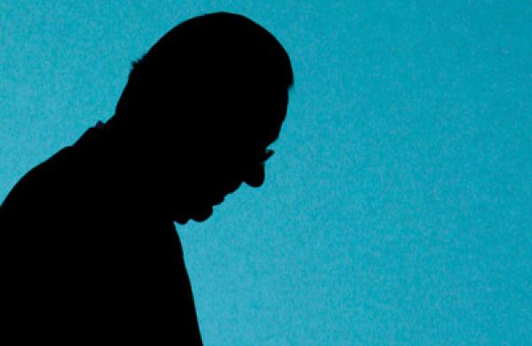 Swiss bank UBS CEO Gruebel is silhouetted as he walks on stage prior the start of the general shareholders meeting in Zurich