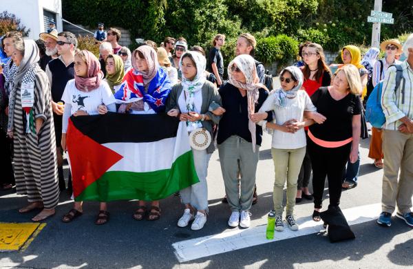 People gather to honor the victims of the Christchurch terrorist attack outside the Kilbernie Mosque in Wellington, New Zealand. (Mark Coote/Bloomberg)