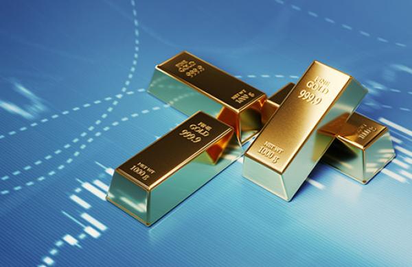 Gold Bars Sitting in Front of Bar Graph - Stock Market and Finance Concept