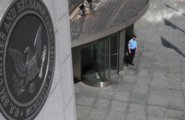 A security officer stands outside the U.S. Securities and Exchange Commission headquarters