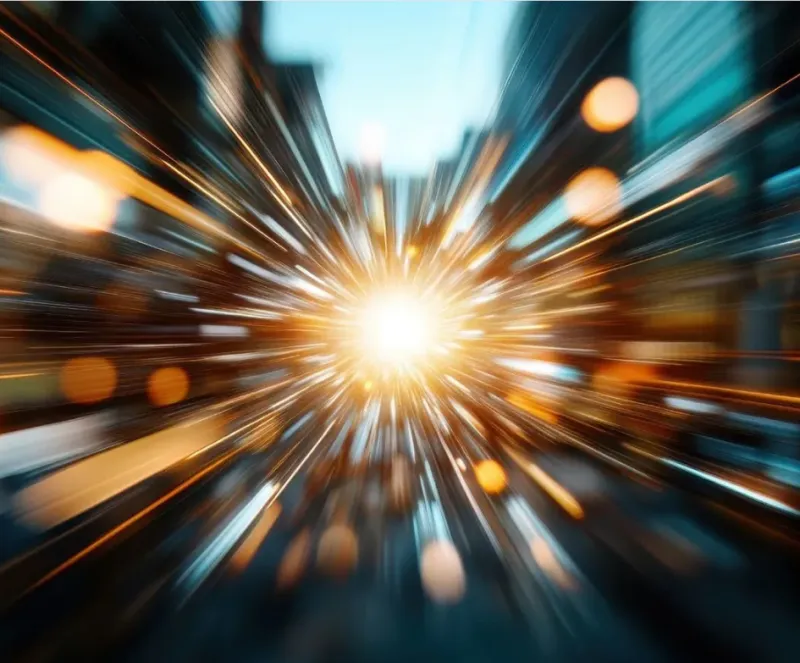 Bright explosion or burst of light with streaks of orange and blue.