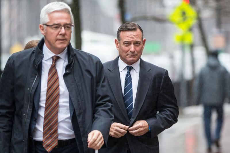 Douglas Hodge, right, enters federal court in Boston, Massachusetts on Feb. 7, 2020. (Scott Eisen/Bloomberg)