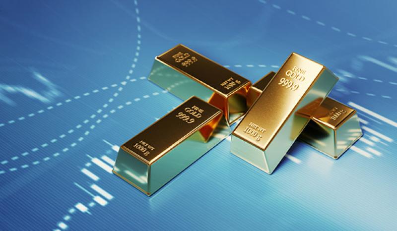 Gold Bars Sitting in Front of Bar Graph - Stock Market and Finance Concept Gold Bars Sitting in Front of Bar Graph - Stock Market and Finance Concept