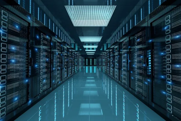 Data center with rows of servers illuminated by blue lights